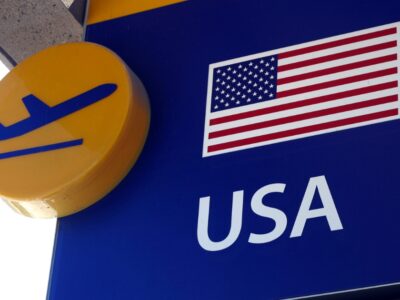 ¿Puedo viajar fuera de USA con ajuste de estatus en proceso?